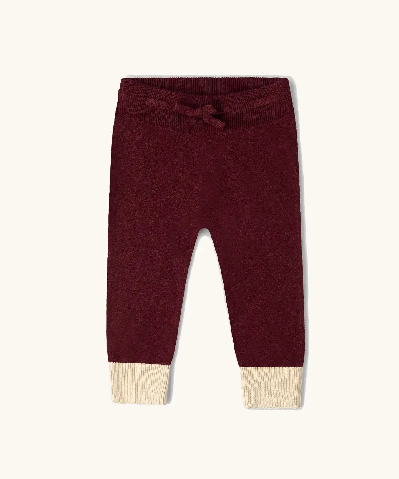 Little Green Radicals organic cotton knitted joggers in a winter berry colour.