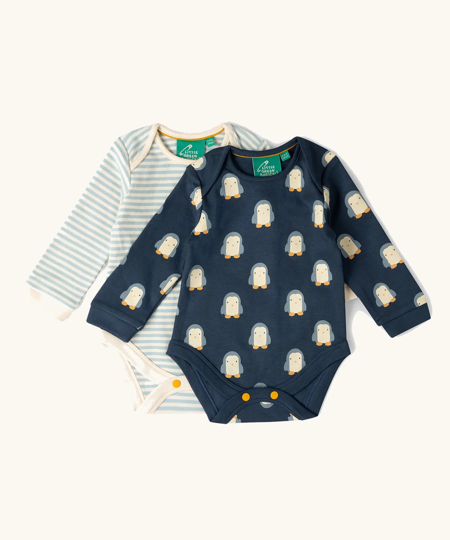 Little Green Radicals organic cotton long-sleeve baby bodysuits 2 pack , one navy with all over penguin print, one blue and white stripes.