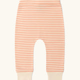 Pink and white striped trousers from the Little Green Radicals organic cotton long sleeve top and jogger playset with pink petals flowers design.