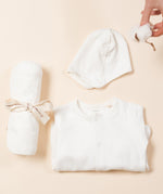 The Little Green Radicals newborn baby giftset, including GOTS certified organic cotton babygrow, hat, and hooded blanket. 