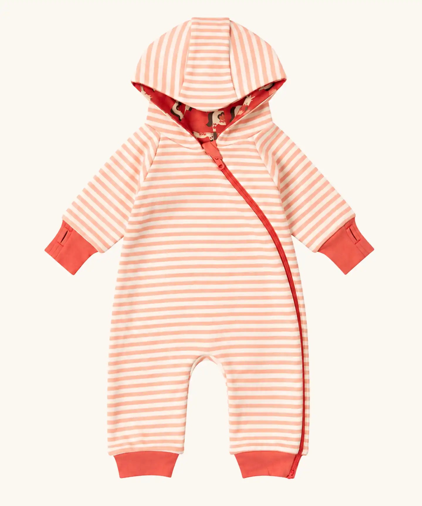 Little Green Radicals pink unicorns organic cotton reversible snug suit. One side is pink with a repeat unicorns print, the other is light pink and white striped. 
