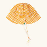 Little Green Radicals organic cotton reversible sunhat on the yellow gold and white gingham print side. 