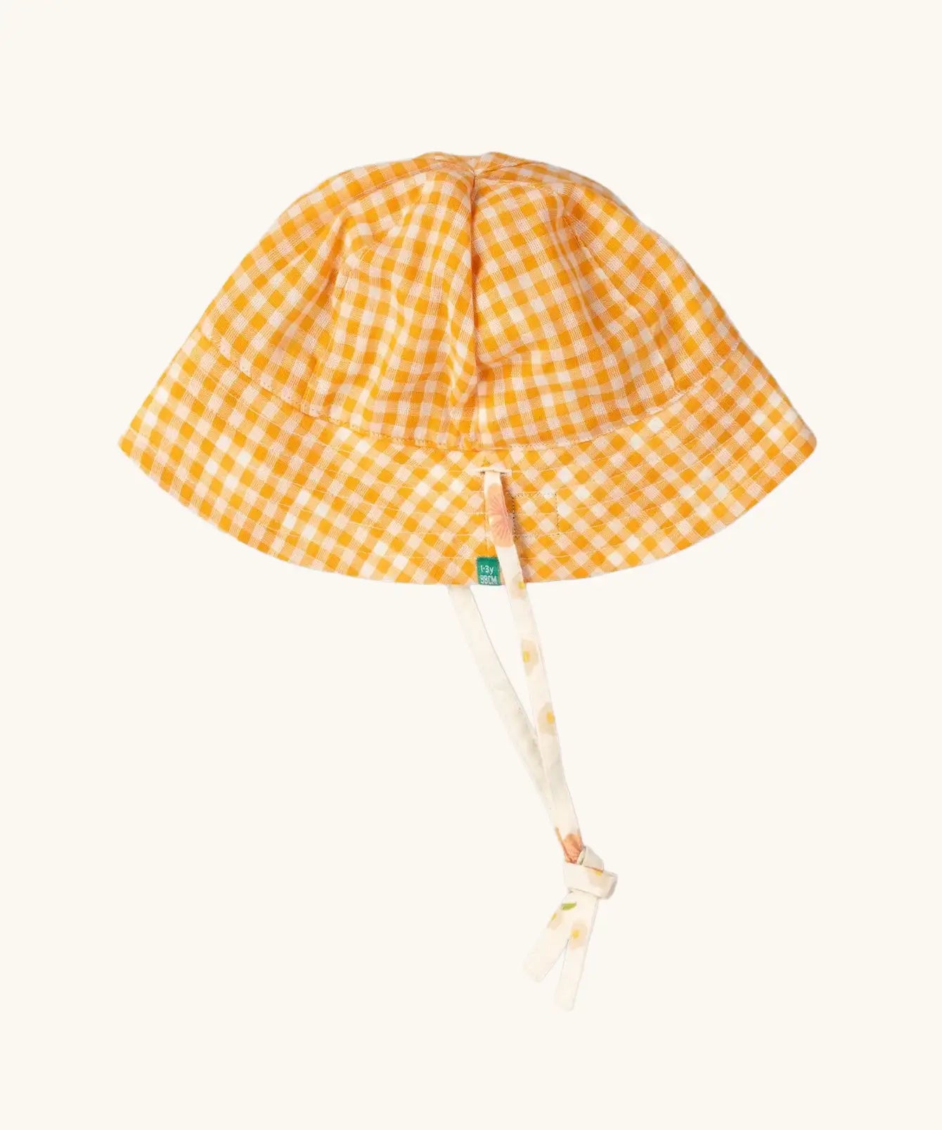 Little Green Radicals organic cotton reversible sunhat on the yellow gold and white gingham print side. 