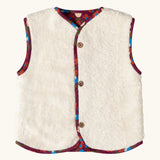 Sherpa side of the Little Green Radicals folk birds organic cotton sherpa fleece reversible gilet. Purple gilet with repeal all over Folk Birds print on one side and sherpa fleece on the other.