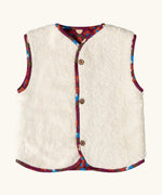 Sherpa side of the Little Green Radicals folk birds organic cotton sherpa fleece reversible gilet. Purple gilet with repeal all over Folk Birds print on one side and sherpa fleece on the other.