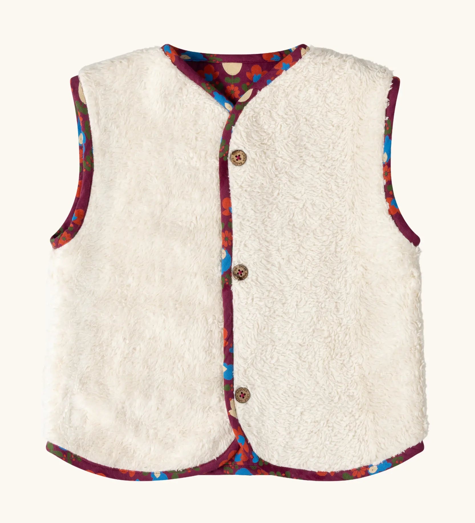 Sherpa side of the Little Green Radicals folk birds organic cotton sherpa fleece reversible gilet. Purple gilet with repeal all over Folk Birds print on one side and sherpa fleece on the other.