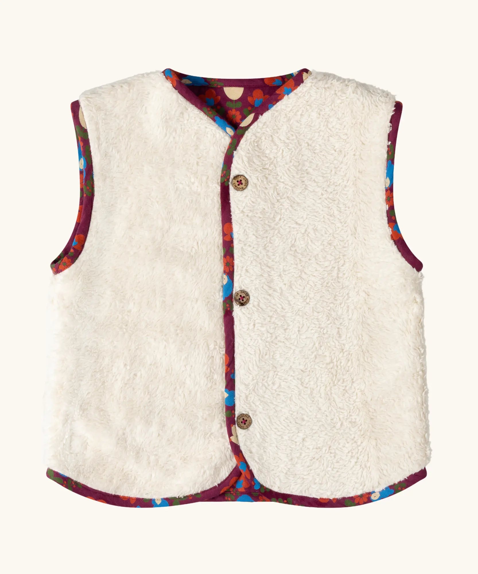 Sherpa side of the Little Green Radicals folk birds organic cotton sherpa fleece reversible gilet. Purple gilet with repeal all over Folk Birds print on one side and sherpa fleece on the other.