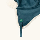 Close up of the Little Green Radicals organic cotton sherpa-lined trapper hat in blue.