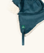 Close up of the Little Green Radicals organic cotton sherpa-lined trapper hat in blue.