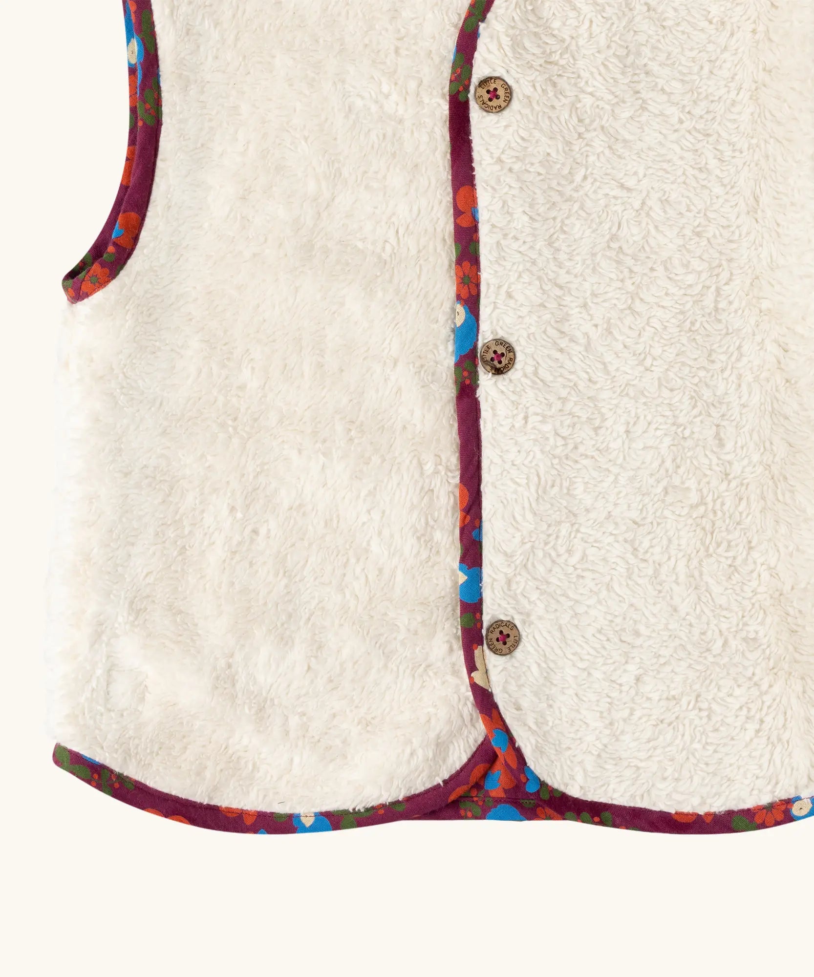 Close up of the sherpa fleece on the Little Green Radicals folk birds organic cotton sherpa fleece reversible gilet. Purple gilet with repeal all over Folk Birds print on one side and sherpa fleece on the other.