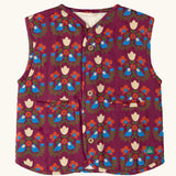 Little Green Radicals folk birds organic cotton sherpa fleece reversible gilet. Purple gilet with repeal all over Folk Birds print on one side and sherpa fleece on the other.