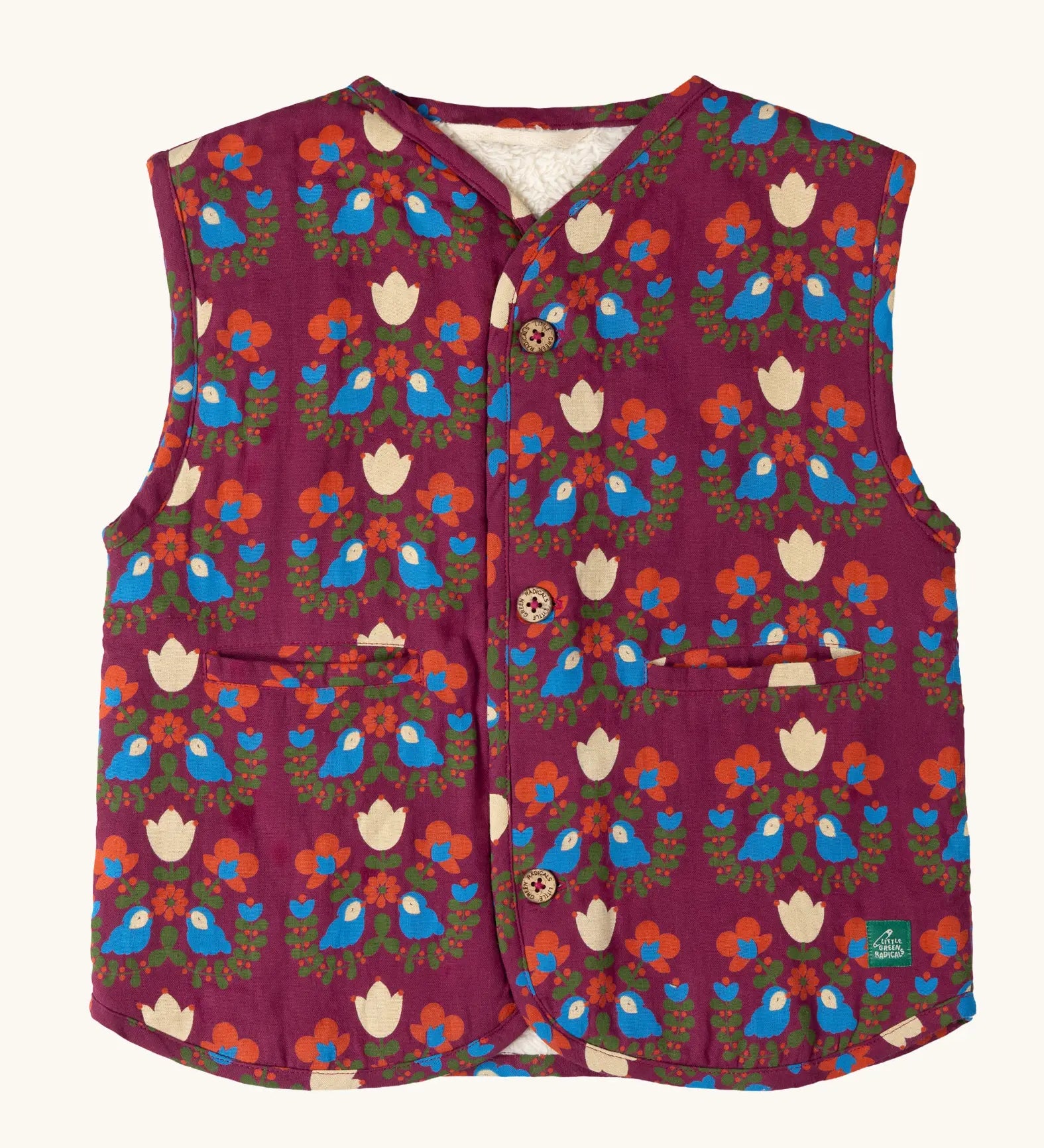 Little Green Radicals folk birds organic cotton sherpa fleece reversible gilet. Purple gilet with repeal all over Folk Birds print on one side and sherpa fleece on the other.