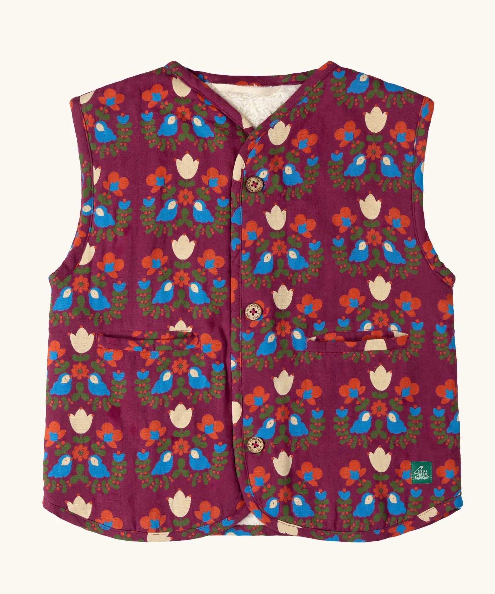 Little Green Radicals folk birds organic cotton sherpa fleece reversible gilet. Purple gilet with repeal all over Folk Birds print on one side and sherpa fleece on the other.