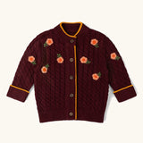 Little Green Radicals organic cotton snuggly knitted cardigan with a berry petal design and yellow edges.