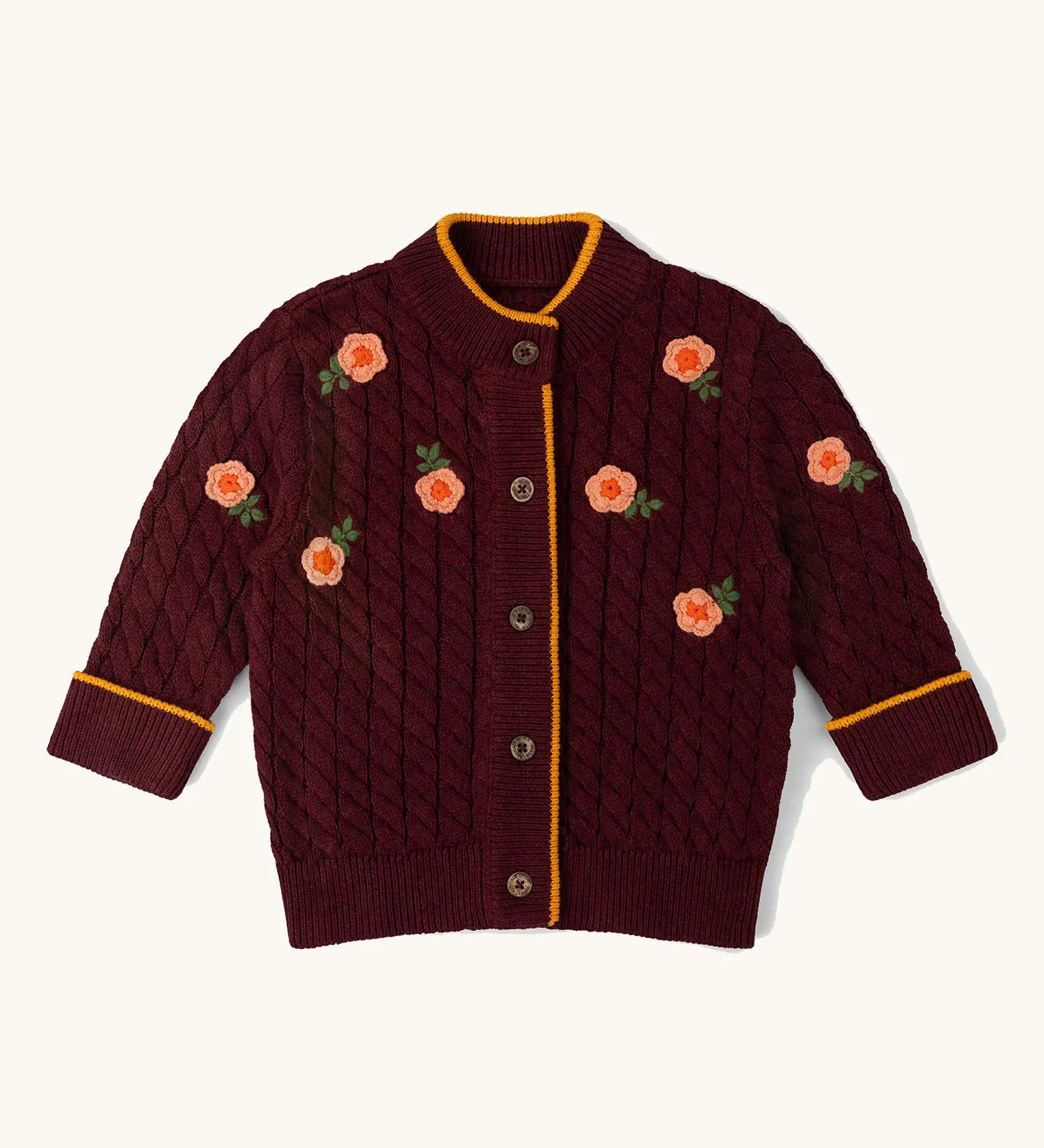 Little Green Radicals organic cotton snuggly knitted cardigan with a berry petal design and yellow edges.