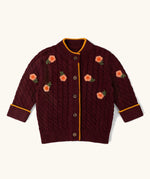 Little Green Radicals organic cotton snuggly knitted cardigan with a berry petal design and yellow edges.