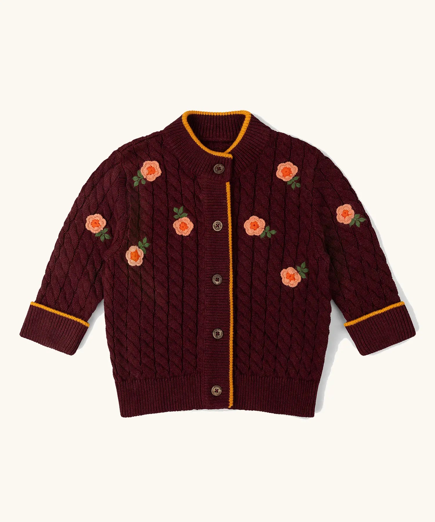 Little Green Radicals organic cotton snuggly knitted cardigan with a berry petal design and yellow edges.