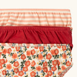 Close up of the elasticated waistbands on the Little Green Radicals organic cotton underwear in a 3 pack. Brief style pants one with a petals print, one red, one pink and white stripes. 