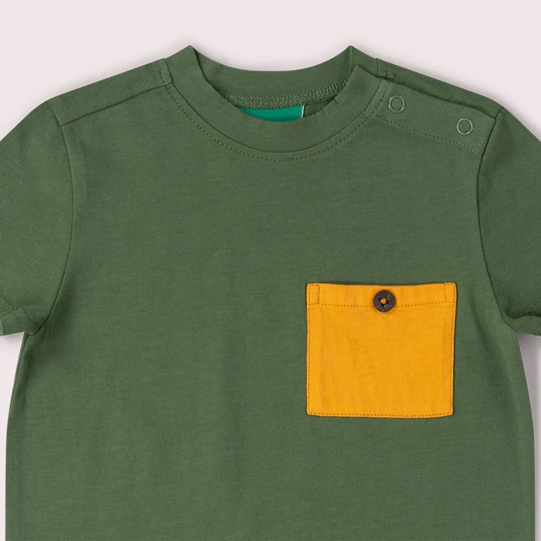 Closeup of Little Green Radicals organic cotton Essential Kids' T-Shirt, showing nickel-free popper fastenings and chest pocket.