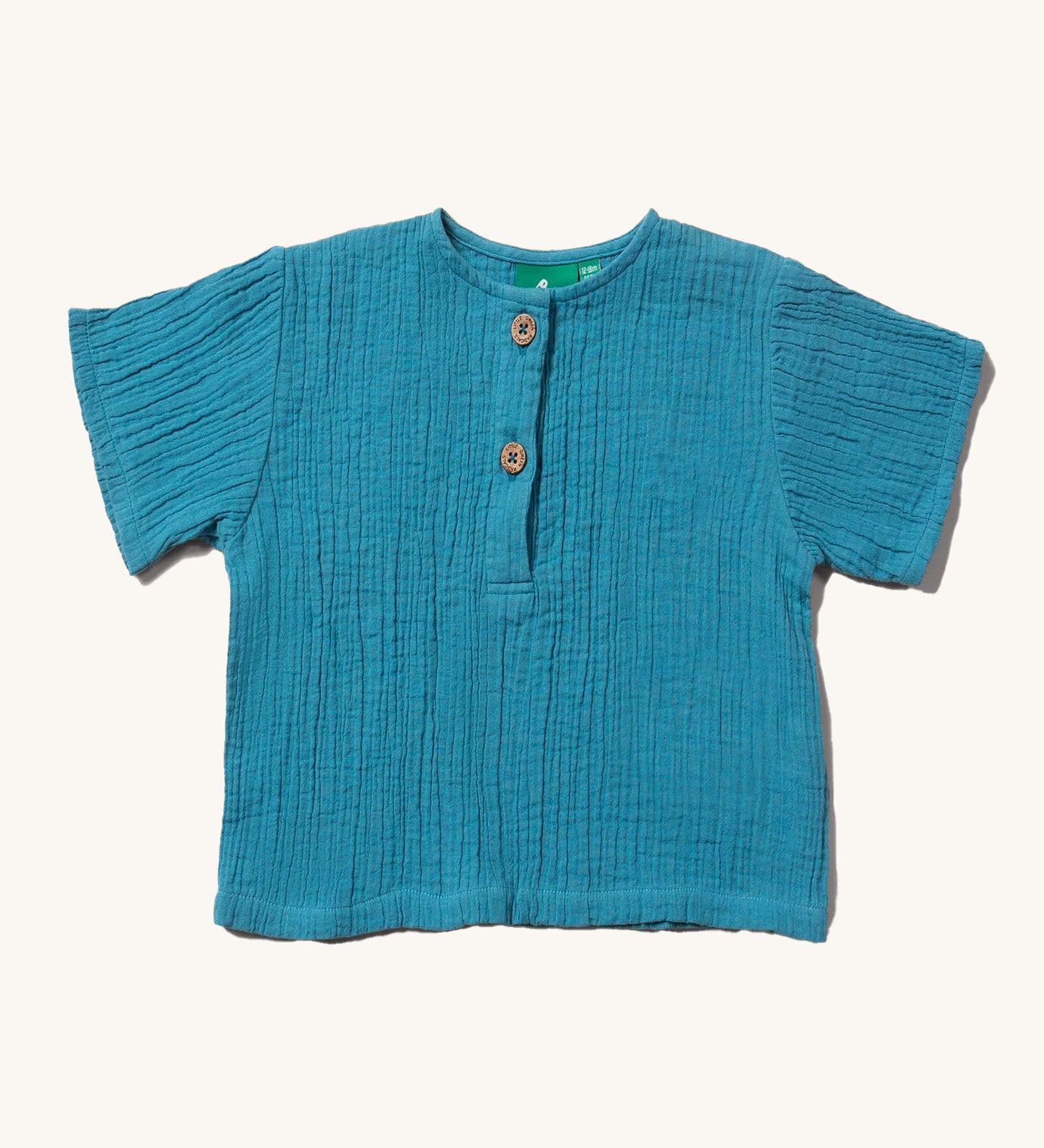 The Little Green Radicals organic and fairtrade cotton muslin Henley top in a sky blue colour.