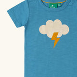 Close up of the white cloud with yellow lightning strike on the front of the Little Green Radicals every cloud short sleeved blue organic cotton t-shirt. 