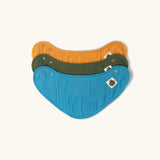 Little Green Radicals blue moon organic cotton muslin bandana bib set. Ochre yellow, dark green and teal blue bibs with green apple tag detail on one side.
