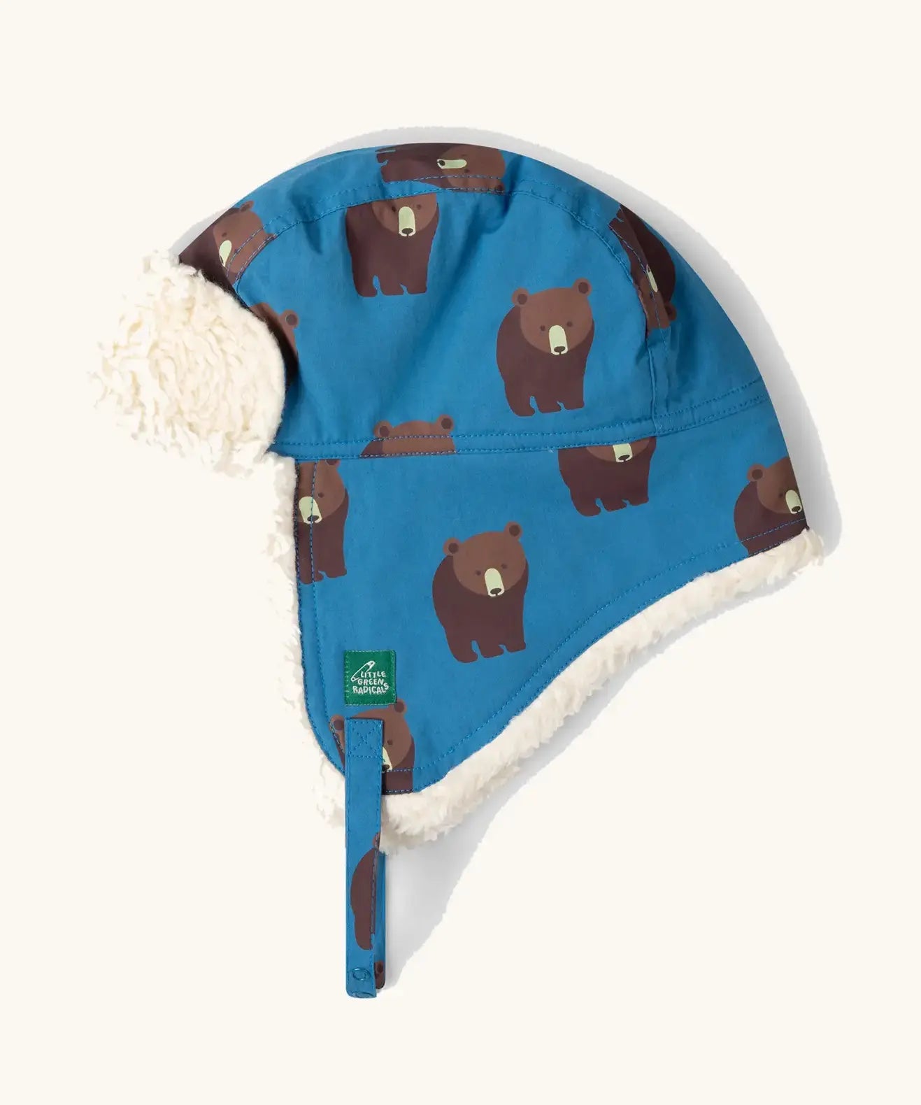 Little Green Radicals organic cotton sherpa-lined trapper hat in blue with a bears print.