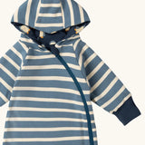 Close up of the Little Green Radicals navy blue penguins hooded reversible snug suit shown with the blue stripe design on the outdide.