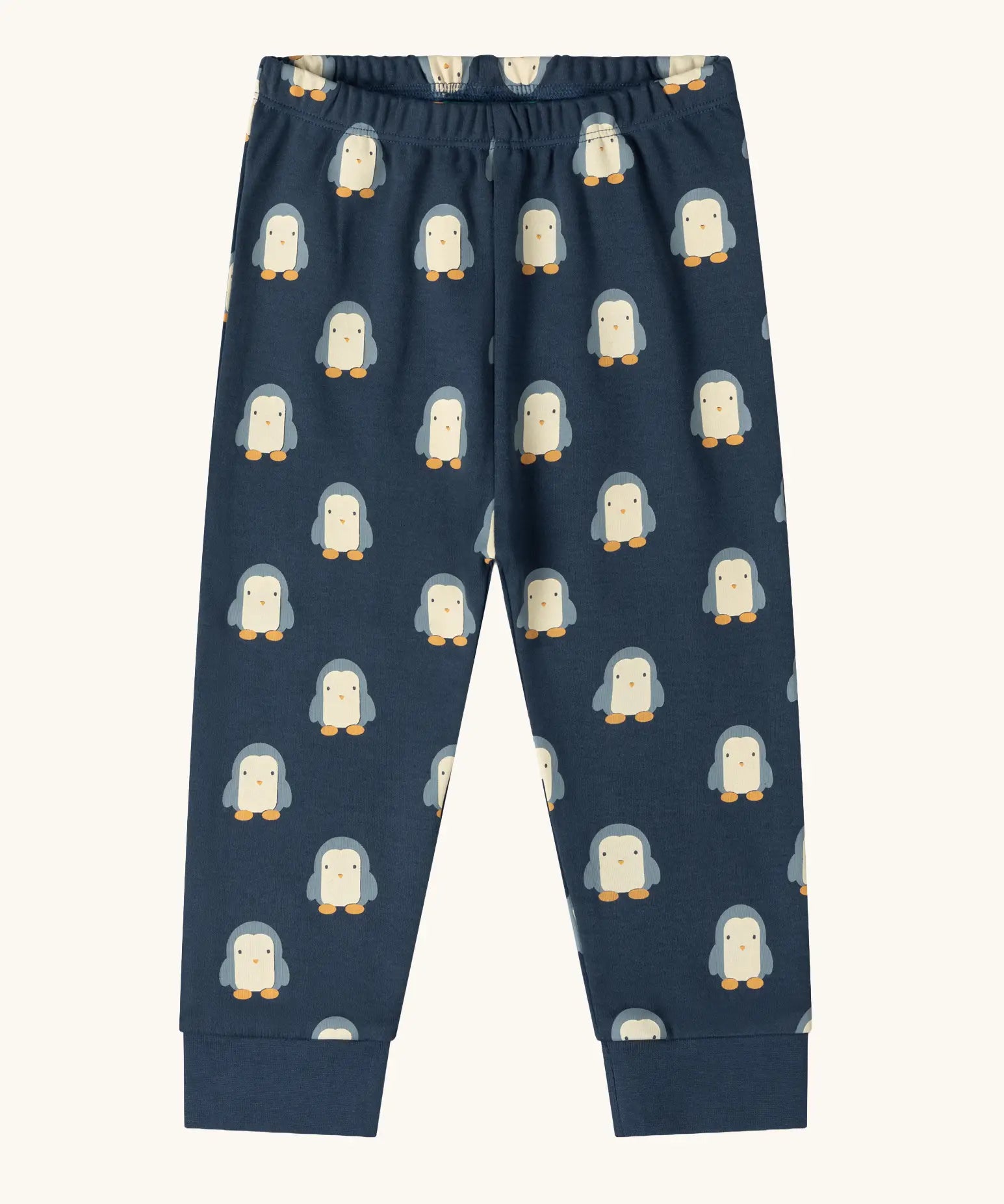 Trousers from the Little Green Radicals penguins kids organic cotton pyjamas. Navy long sleeved pyjamas with all over repeat penguin print. 