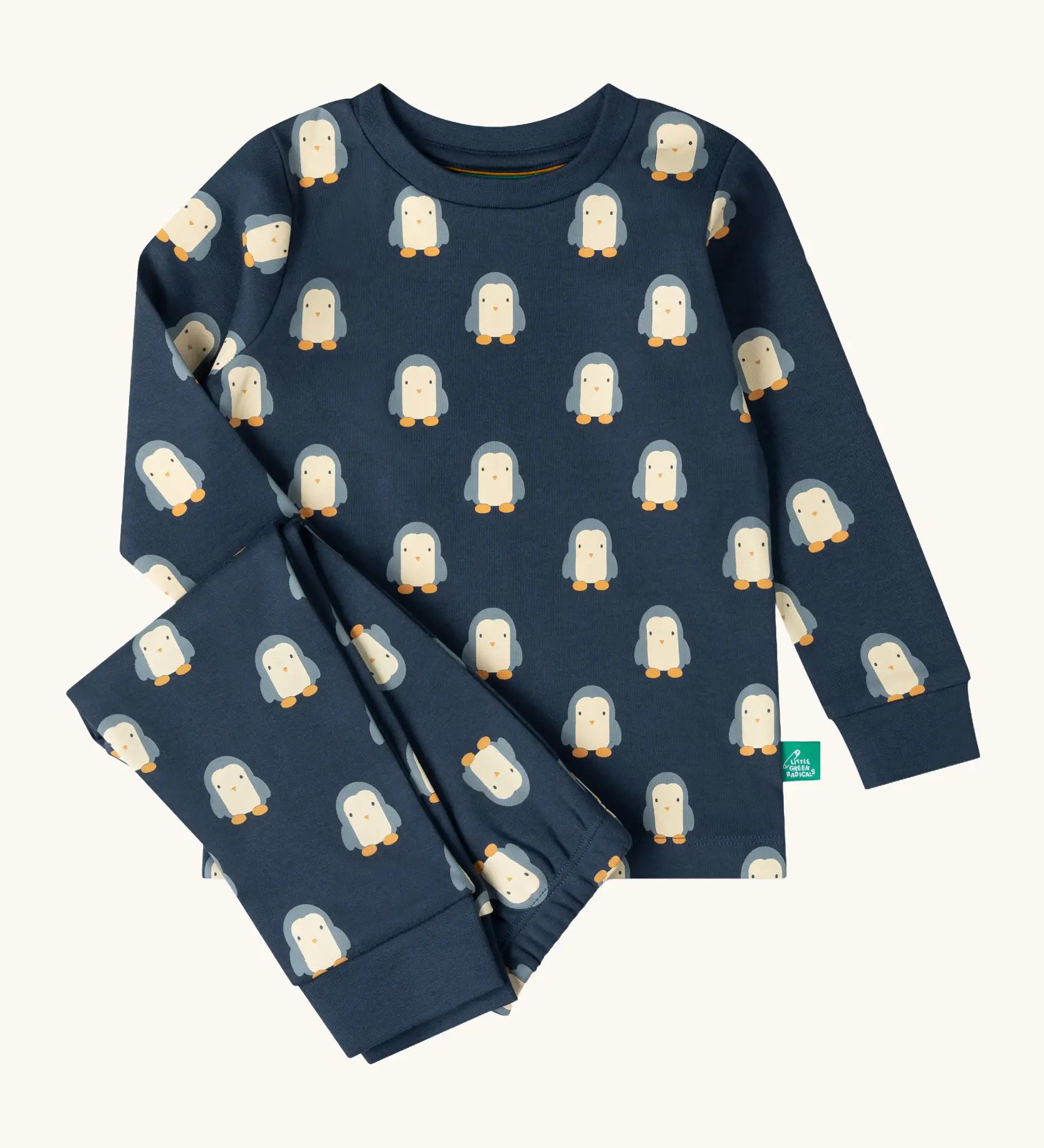 Little Green Radicals penguins kids organic cotton pyjamas. Navy long sleeved pyjamas with all over repeat penguin print. 