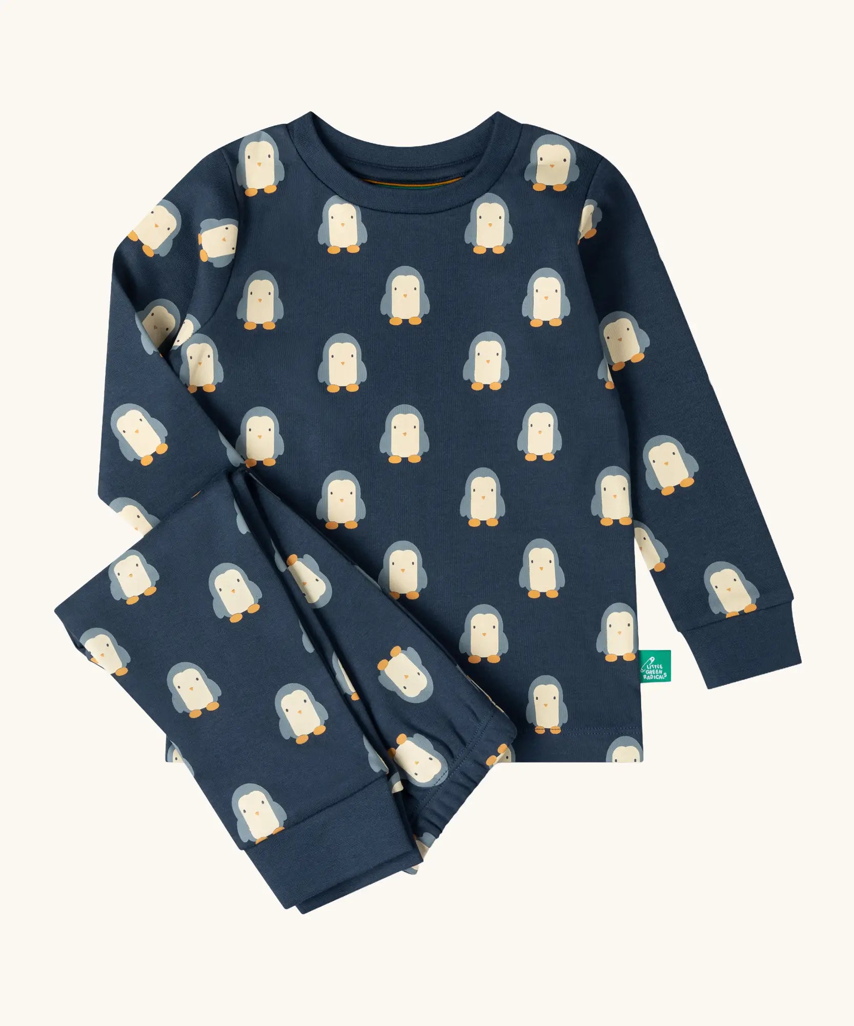 Little Green Radicals penguins kids organic cotton pyjamas. Navy long sleeved pyjamas with all over repeat penguin print. 