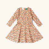 Little Green Radicals petals print organic cotton spinny dress. Light coloured dress with an all over repeat floral print.