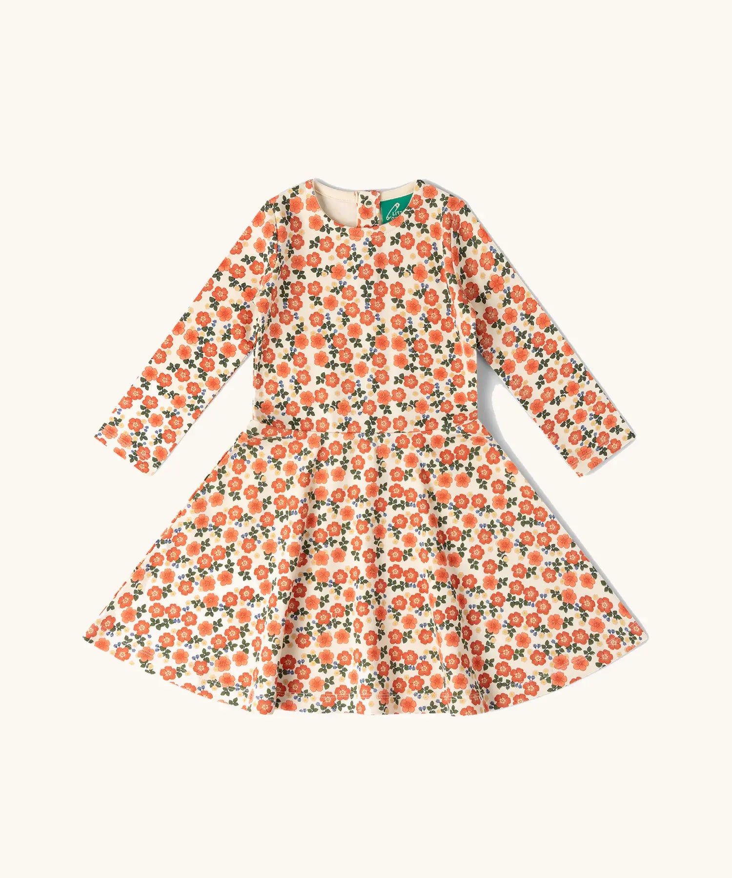 Little Green Radicals petals print organic cotton spinny dress. Light coloured dress with an all over repeat floral print.