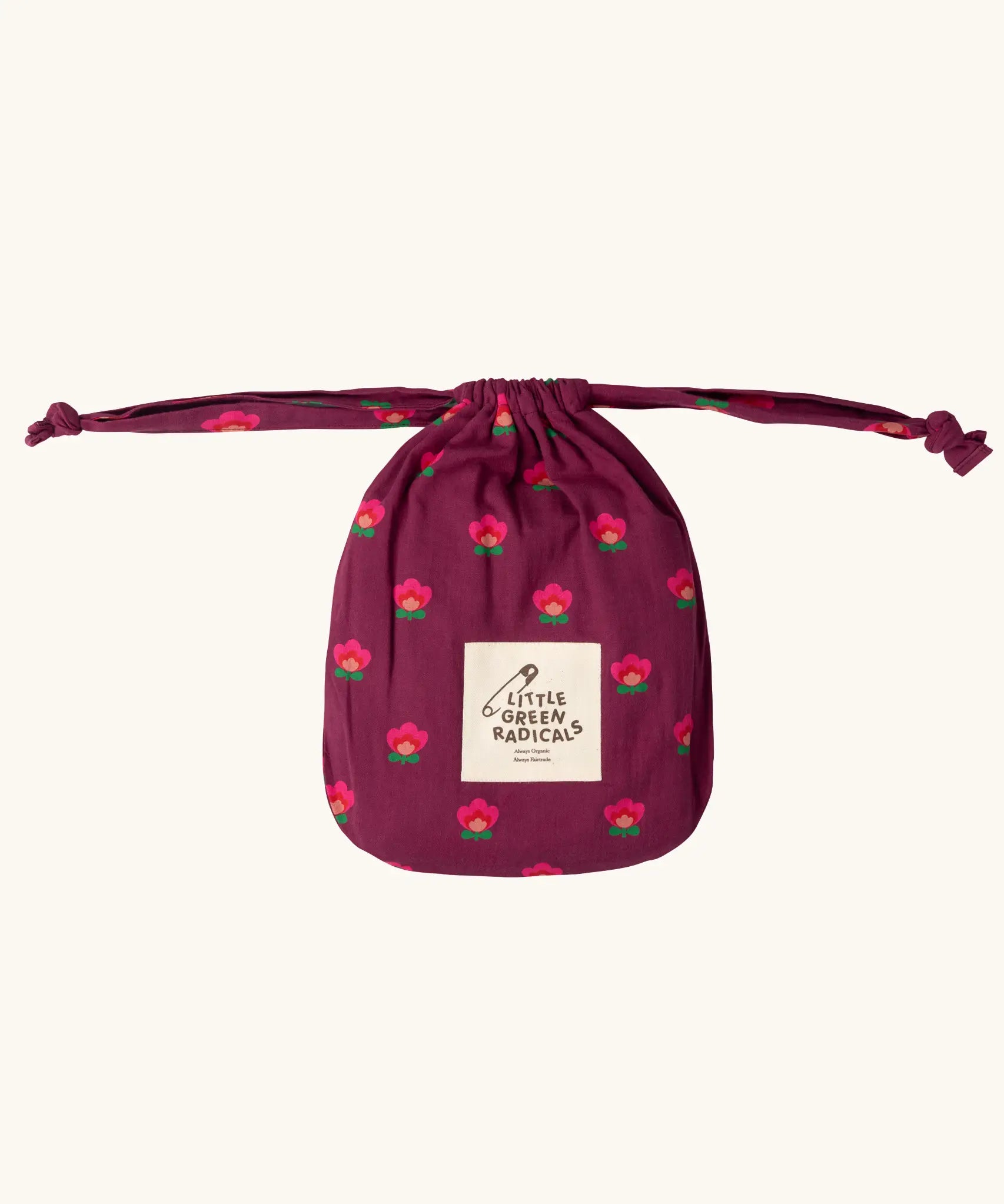 Storage bag that the Little Green Radicals pink flowers print organic cotton classic purple pyjamas come inside. 