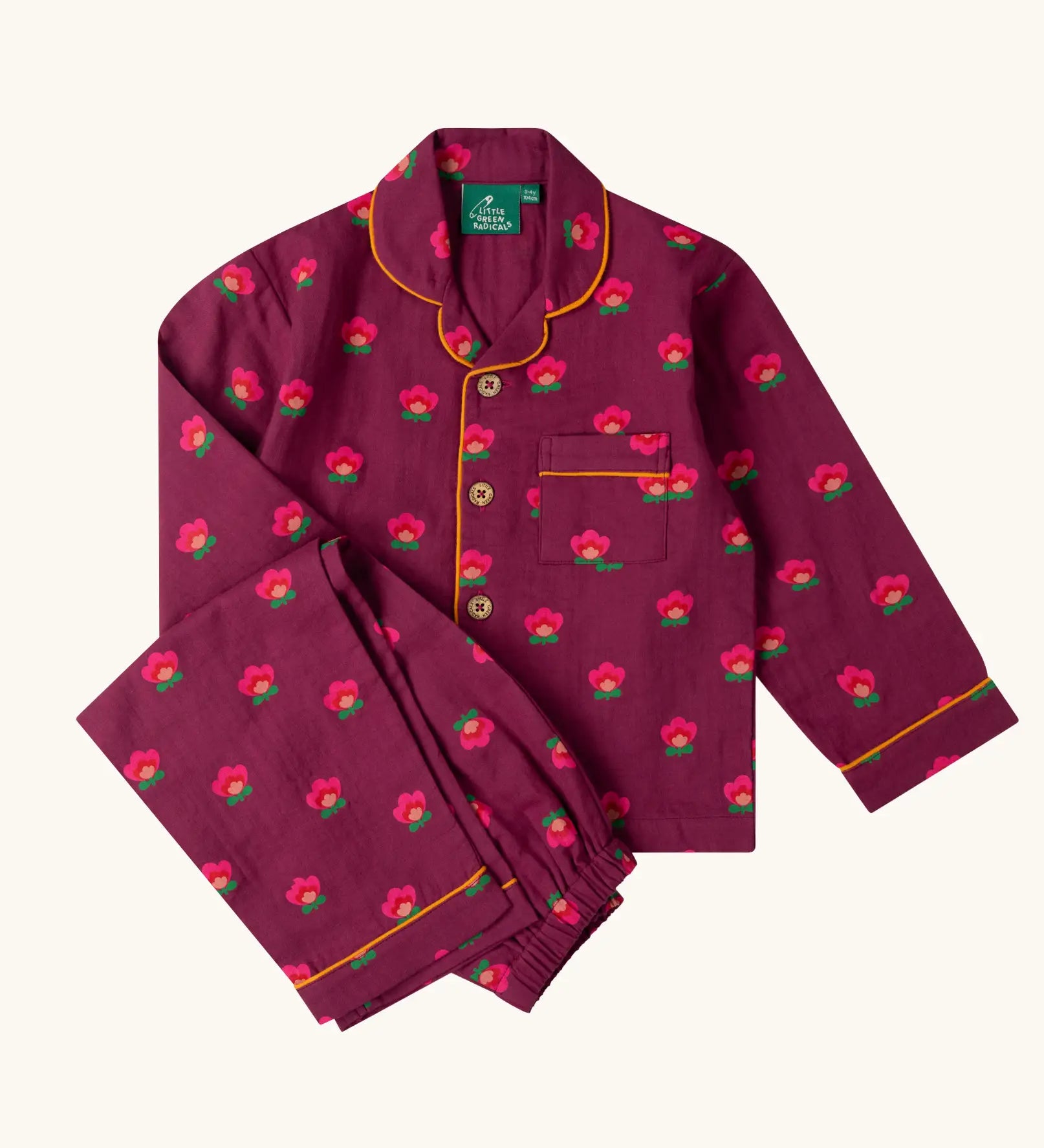 Little Green Radicals pink flowers print organic cotton classic purple pyjamas. Long sleeve button up top with matching trousers.