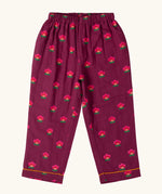 Trousers from the Little Green Radicals pink flowers print organic cotton classic purple pyjamas. Long sleeve button up top with matching trousers.