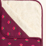 Close up of the fleece on the Little Green Radicals pink flowers organic cotton sherpa hooded baby blanket.