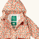 Close up of the Little Green Radicals pink petals recycled waterproof adventure lined Winter coat showing the hood and fleece lining.