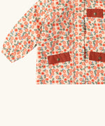 Close up of the pockets on the front of the Little Green Radicals pink petals recycled waterproof adventure lined Winter coat.