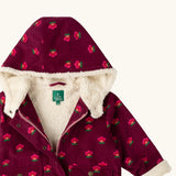 Close up of the sherpa fleece lining on the inside of the Little Green Radicals pink flowers pattern purple organic cotton sherpa toasty coat.