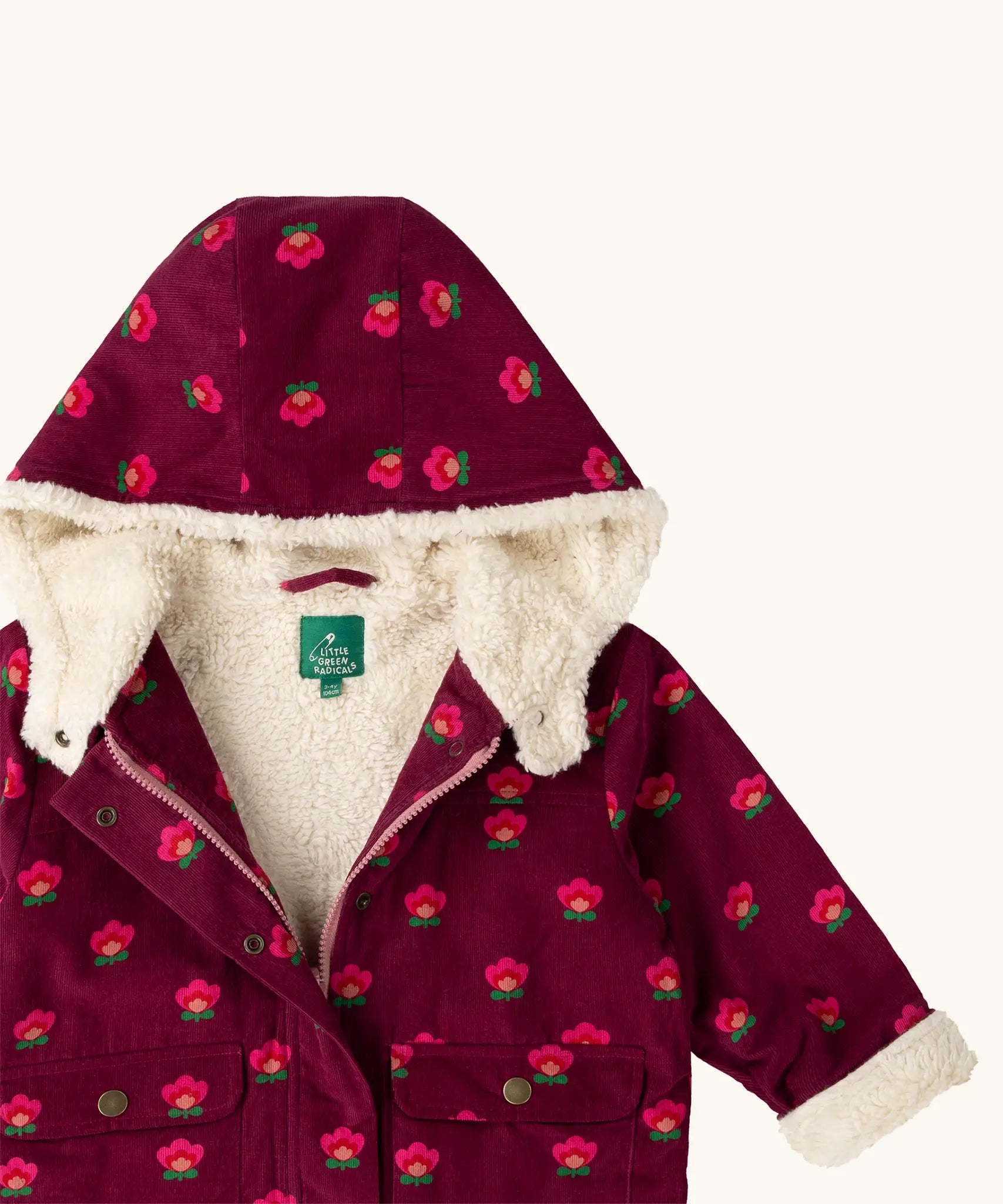 Close up of the sherpa fleece lining on the inside of the Little Green Radicals pink flowers pattern purple organic cotton sherpa toasty coat.