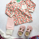 Little Green Radicals Organic Cotton T-Shirt & Jogger Playset with the Petals laid out next to a pair of pink Froddo barefoot shoes.
