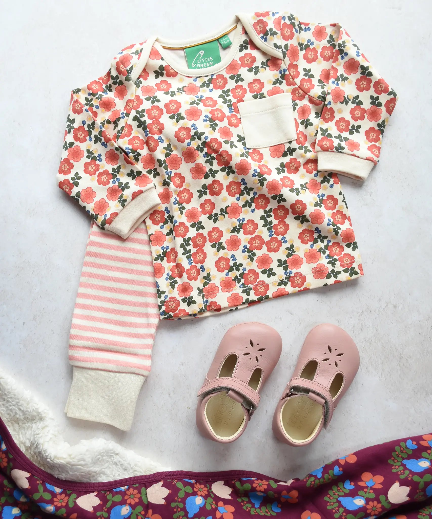 Little Green Radicals Organic Cotton T-Shirt & Jogger Playset with the Petals laid out next to a pair of pink Froddo barefoot shoes.
