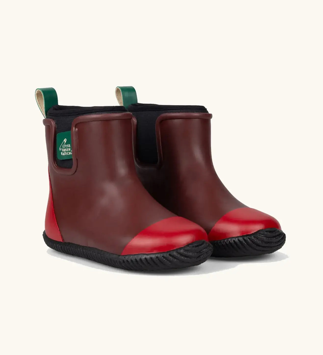 Little Green Radicals plum natural rubber kids ankle rain boots with red toe and heel caps. 