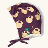 Little Green Radicals  sleeping swans print sherpa fleece lined purple hat. Purple organic cotton sherpa fleece lined flapper style hat with a sleeping swans print. 