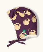 Little Green Radicals  sleeping swans print sherpa fleece lined purple hat. Purple organic cotton sherpa fleece lined flapper style hat with a sleeping swans print. 