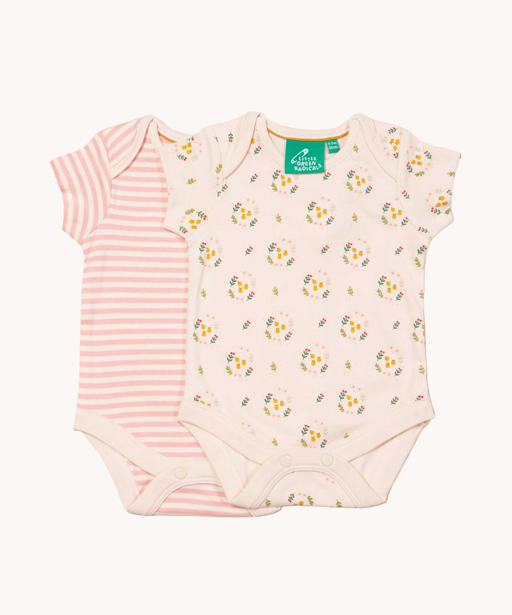 A 2 pack of Little Green Radicals Quince Flowers Baby Body Set. One vest has a pink and white stripe with the other vest featuring an all over quince flower print. These short sleeved baby best are part of a wide range of organic cotton baby clothes available at Babipur. 