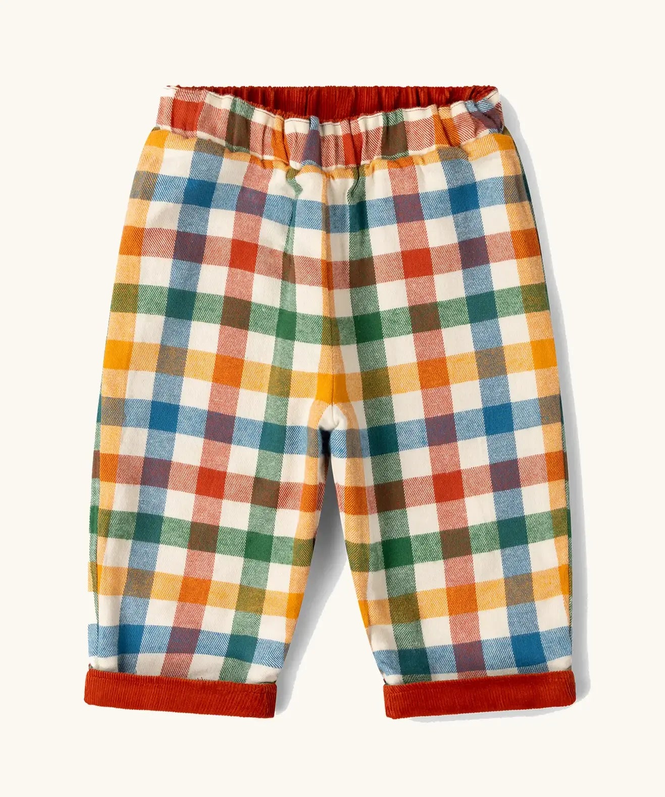 Little Green Radicals organic cotton reversible pull on trousers shown on the multi colour check brushed side.