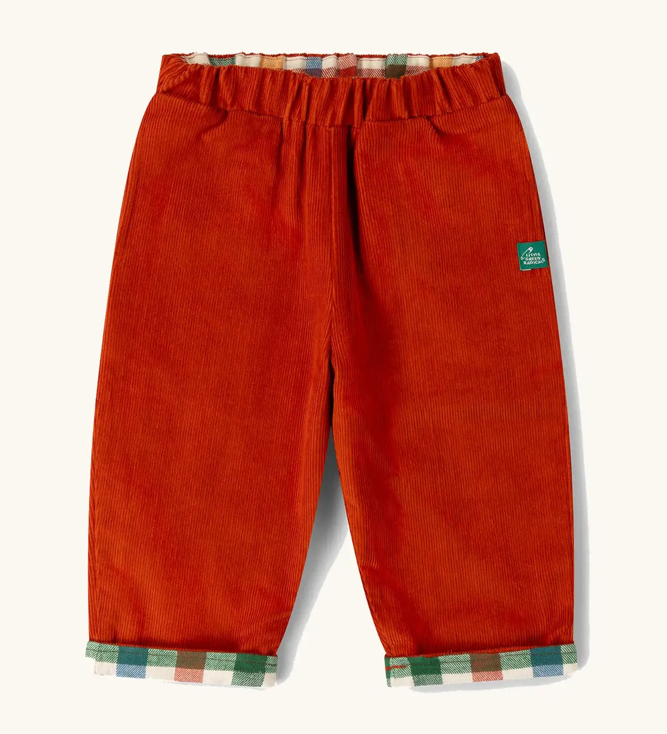 Little Green Radicals organic cotton reversible pull on trousers shown on the rusty orange cord side.