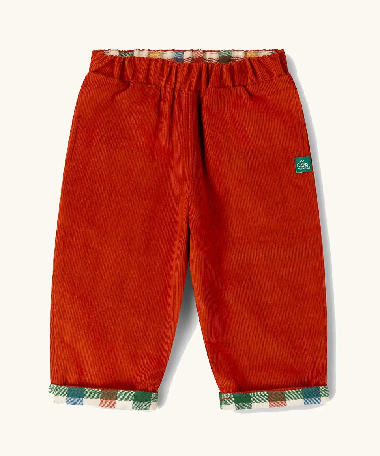 Little Green Radicals organic cotton reversible pull on trousers shown on the rusty orange cord side.